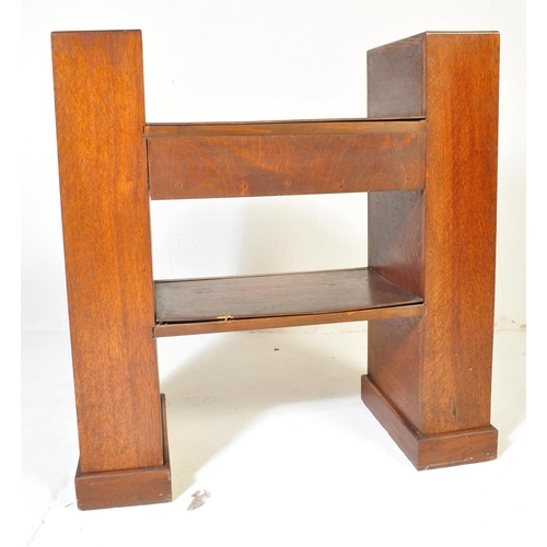 710 - An Art Deco early 20th century circa 1930s oak wood hall desk. The desk having a central top with si... 