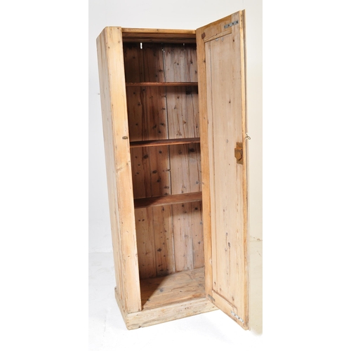 711 - A 19th century pine wood hall cupboard. The wardrobe having a straight top over a single door with b... 