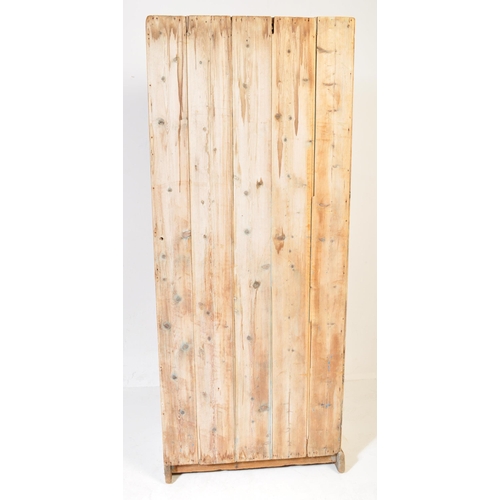 711 - A 19th century pine wood hall cupboard. The wardrobe having a straight top over a single door with b... 