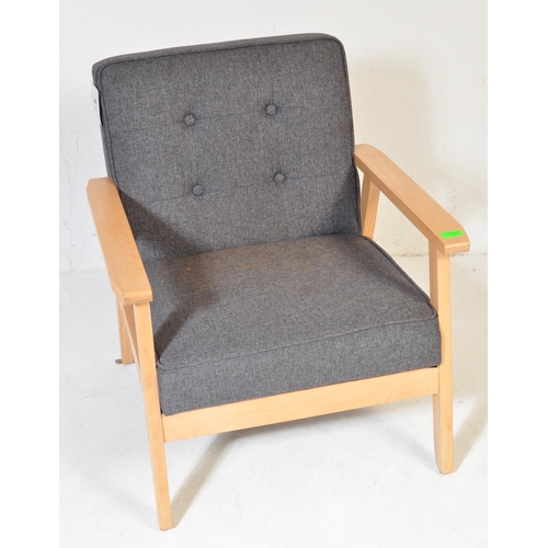 725 - A contemporary retro style IKEA lounge easy chair having a wooden open frame with upholstered grey c... 