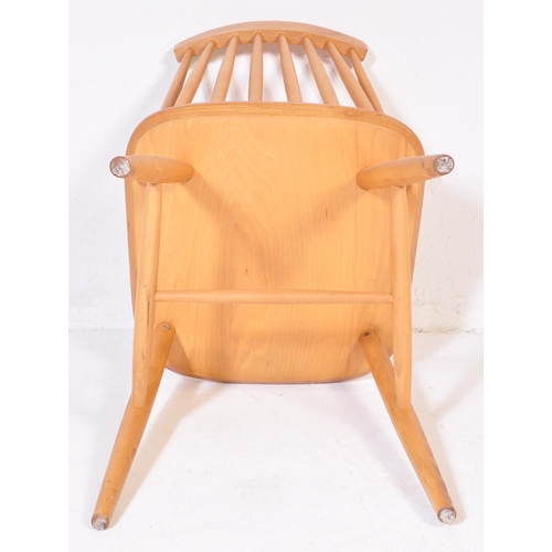 735 - Manner of Ercol Furniture – Pair of blond wood dining chairs. Raised on turned legs with stretchers,... 