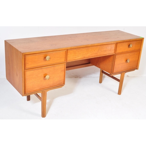 746 - A retro vintage mid 20th Century teak wood dressing table. Of rectangular form with single secret dr... 
