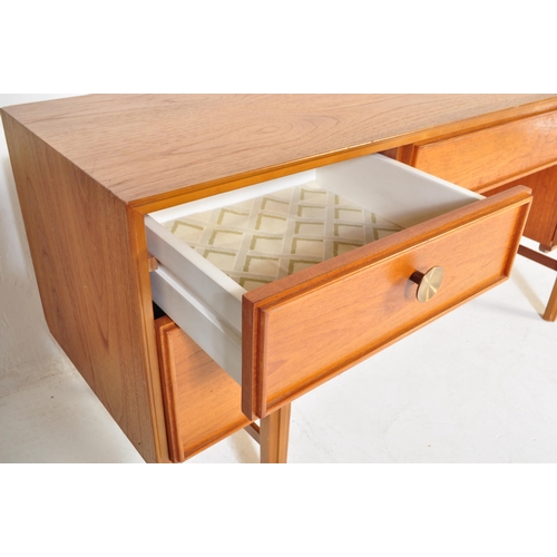 746 - A retro vintage mid 20th Century teak wood dressing table. Of rectangular form with single secret dr... 
