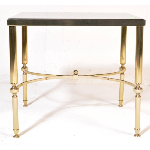 752 - A 20th Century 1980s Hollywood Regency brass framed coffee table / low table of square form having a... 