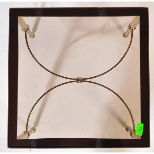 752 - A 20th Century 1980s Hollywood Regency brass framed coffee table / low table of square form having a... 