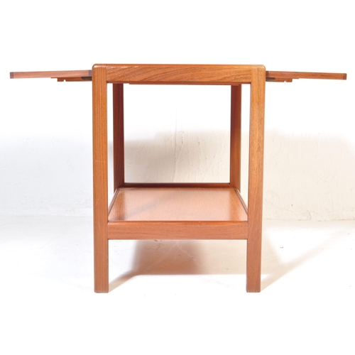 765 - A mid 20th Century retro vintage teak wood serving trolley. With twin drop leaves rectangular form w... 