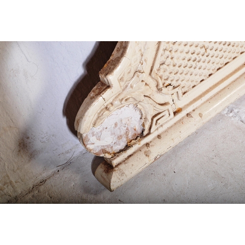 813 - A 19th Century Victorian over mantel wall mirror of oval form having a large glass mirror panel set ... 