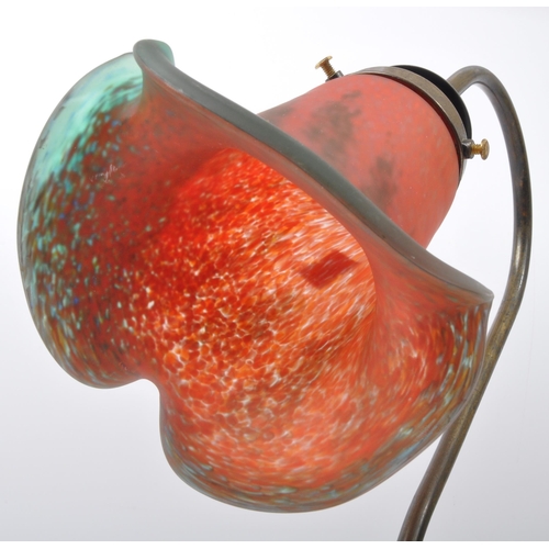 823 - An early 20th Century French Art Nouveau glass table lamp light. Having a brass metal arm with paint... 