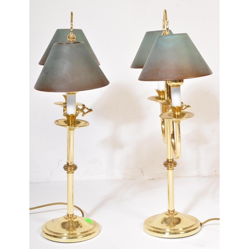 828 - A pair of retro vintage 20th century circa 1980s gilt metal Casino table top lamps. The lights havin... 
