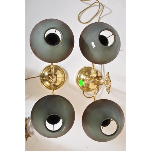 828 - A pair of retro vintage 20th century circa 1980s gilt metal Casino table top lamps. The lights havin... 