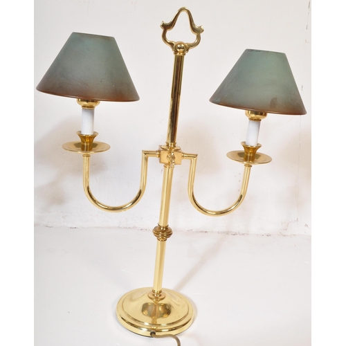 828 - A pair of retro vintage 20th century circa 1980s gilt metal Casino table top lamps. The lights havin... 