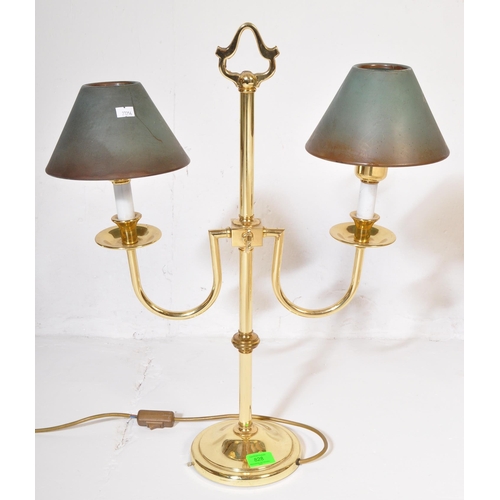 828 - A pair of retro vintage 20th century circa 1980s gilt metal Casino table top lamps. The lights havin... 