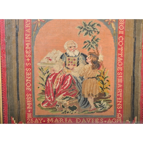 834 - An early 20th century Berlin woolwork needlepoint sampler of religious subject matter depicting Samu... 