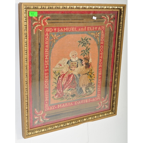 834 - An early 20th century Berlin woolwork needlepoint sampler of religious subject matter depicting Samu... 