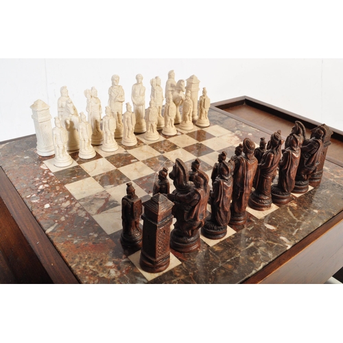 852 - A vintage wood custom chess board table. The game table having a fitted stone chess board with mould... 