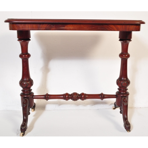 853 - A 19th century Victorian mahogany occasional writing / side table. The top having chamfered edge ove... 