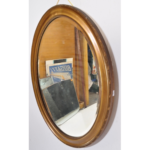 856 - A vintage 20th century 1930's oak glazed cabinet having twin doors opening to reveal a shelved inter... 