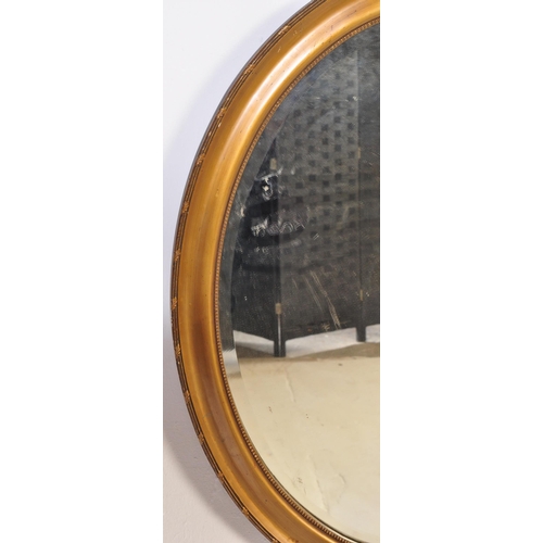 856 - A vintage 20th century 1930's oak glazed cabinet having twin doors opening to reveal a shelved inter... 