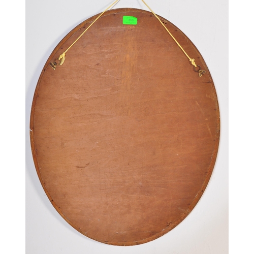 856 - A vintage 20th century 1930's oak glazed cabinet having twin doors opening to reveal a shelved inter... 