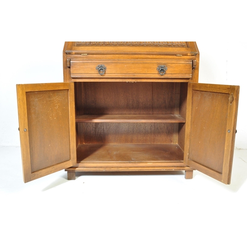 930 - A Jacobean revival 20th century Old Charm / Jaycee manner oak bureau desk. With linen fold design to... 