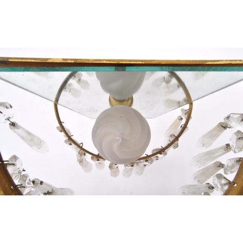 961 - A pair of early 20th Century gilt metal wall lights. Having loose mirror back with decorated gilt me... 