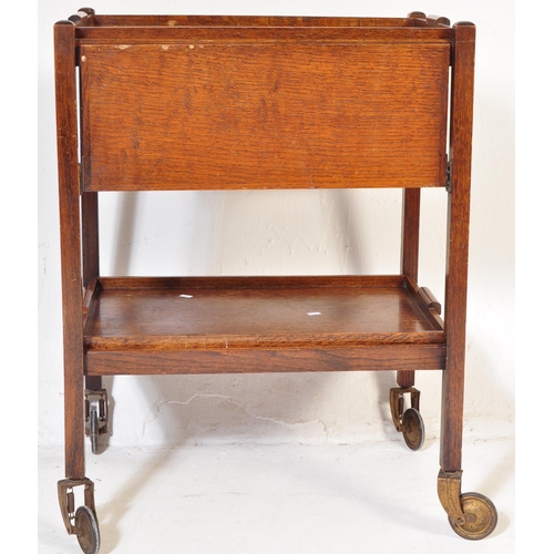 978 - An early 20th century circa 1930s oak wood hostess folding drink trolley having tow removable tiers ... 