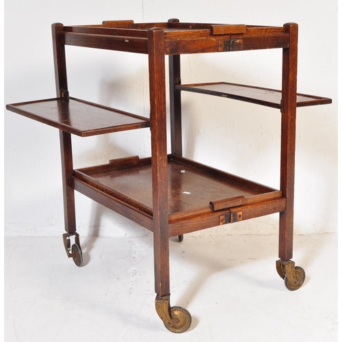 978 - An early 20th century circa 1930s oak wood hostess folding drink trolley having tow removable tiers ... 