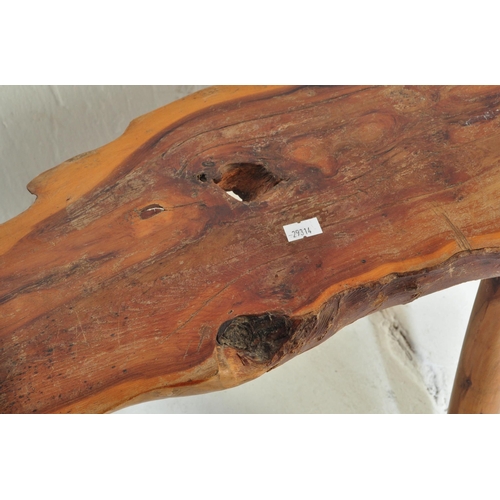 981 - A contemporary driftwood rustic bench / table from a member of the Gloucestershire Guild of Craftsme... 