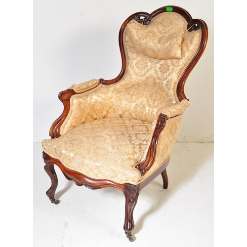 984 - A 19th Century Victorian carved mahogany library / nursing chair. Having a shaped back rest with str... 