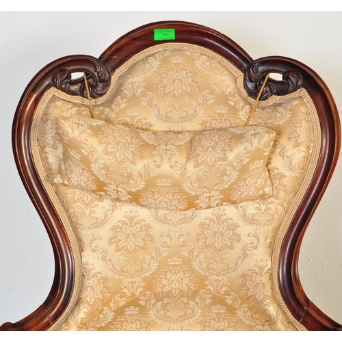 984 - A 19th Century Victorian carved mahogany library / nursing chair. Having a shaped back rest with str... 