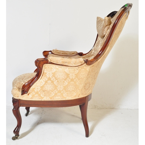 984 - A 19th Century Victorian carved mahogany library / nursing chair. Having a shaped back rest with str... 