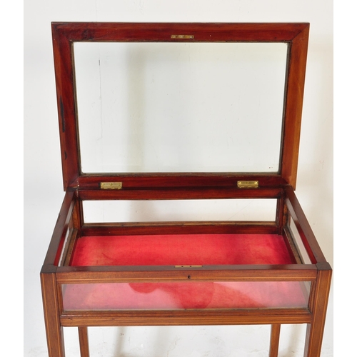 987 - An Edwardian early 20th Century circa 1900s bijouterie cabinet table. Of rectangular form with glass... 