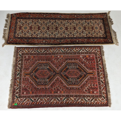 922 - A collection of two Vintage 20th Century Persian Islamic floor rug carpets. One Kashan runner with r... 