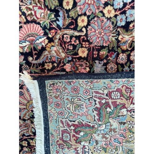 924 - A vintage 20th Century hand knotted Kirman Persian Islamic floor carpet rug. Having an intricate pol... 