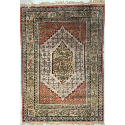 933 - A large mid 20th Century Turkish woven floor rug / carpet having repeating geometric and floral patt... 