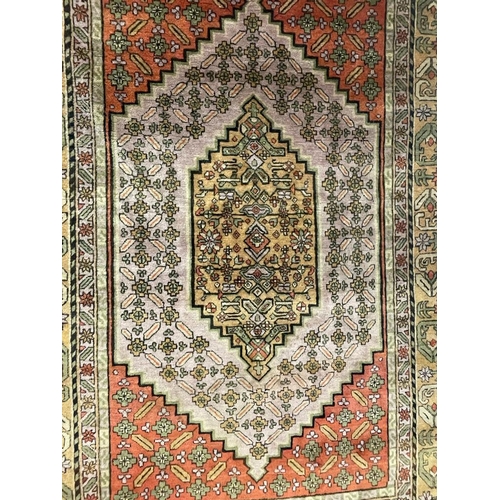 933 - A large mid 20th Century Turkish woven floor rug / carpet having repeating geometric and floral patt... 