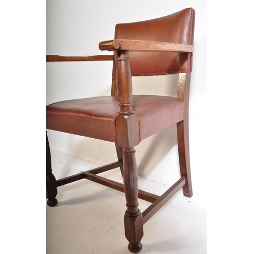 1043 - A mid 20th century circa. 1940's carver desk chair. The chair having oak arm rests over seat and bac... 