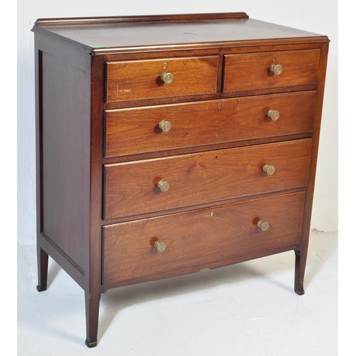 1050 - A mid century Air Ministry style mahogany chest of drawers. Raised on stile supports with 2 short ov... 