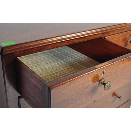 1050 - A mid century Air Ministry style mahogany chest of drawers. Raised on stile supports with 2 short ov... 