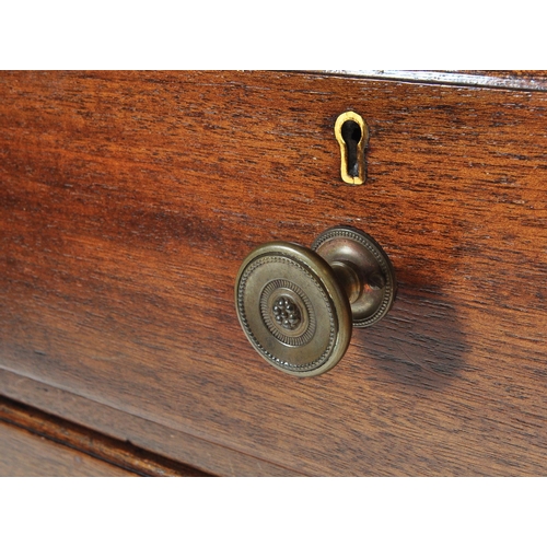 1050 - A mid century Air Ministry style mahogany chest of drawers. Raised on stile supports with 2 short ov... 