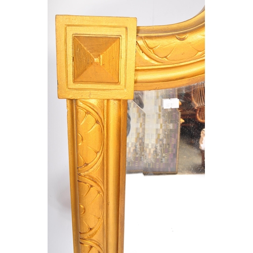 1051 - A large early 20th Century circa 1920s wooden gilt frame bevelled edge over mantel mirror. Having an... 