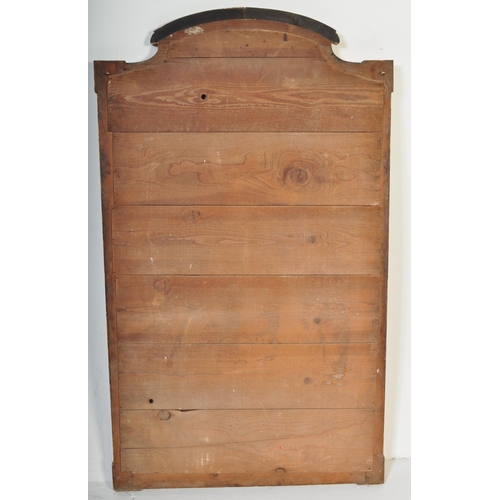 1051 - A large early 20th Century circa 1920s wooden gilt frame bevelled edge over mantel mirror. Having an... 