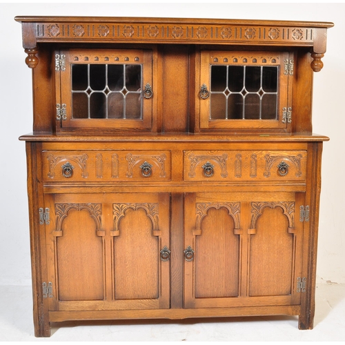1056 - Wood Bros - Old Charm Furniture A 20th century Jacobean revival oak court cupboard by Old Charm Wood... 
