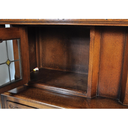 1056 - Wood Bros - Old Charm Furniture A 20th century Jacobean revival oak court cupboard by Old Charm Wood... 