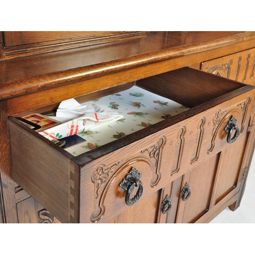 1056 - Wood Bros - Old Charm Furniture A 20th century Jacobean revival oak court cupboard by Old Charm Wood... 