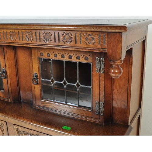 1056 - Wood Bros - Old Charm Furniture A 20th century Jacobean revival oak court cupboard by Old Charm Wood... 