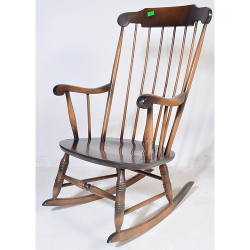 1057 - A pair of Victorian antique style rocking chair / windsor armchairs. Sleigh runners with turned legs... 