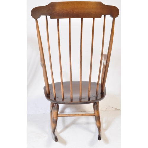 1057 - A pair of Victorian antique style rocking chair / windsor armchairs. Sleigh runners with turned legs... 