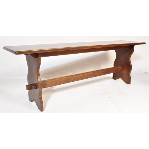 1058 - Wood Bros - Old Charm Furniture - 20th Jacobean revival oak bench seat raised on shaped legs with st... 