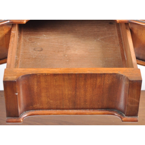 1064 - A Victorian 19th century large mahogany Duchess dressing table. Raised on hairy paw feet legs with l... 